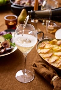 Coq au vin and potato dauphinois prepared ahead for an autumn dinner party