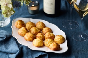 French gougères served with Champagne for Thanksgiving entertaining.