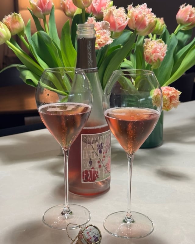 Thursday evenings are made for something softer: pink bubbles and tulips in bloom. 

Champagne rosé is created either by blending white and red wines (rosé d’assemblage), or by brief skin contact with red grapes (rosé de saignée)—a delicate balance of colour, aroma, and craft. 

There’s a champagne rosé for every palate, preference and occasion. 

Slow down. Sip. Savour. 🍾 Discover more via the link in bio.

#sallyhillman
#celebratingchampagne
#champagnerose 
#winelover 
#luxurylifestyle